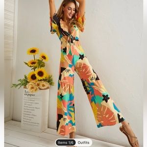 Plunging Neck Tie Front Wide Leg Tropical Jumpsuit